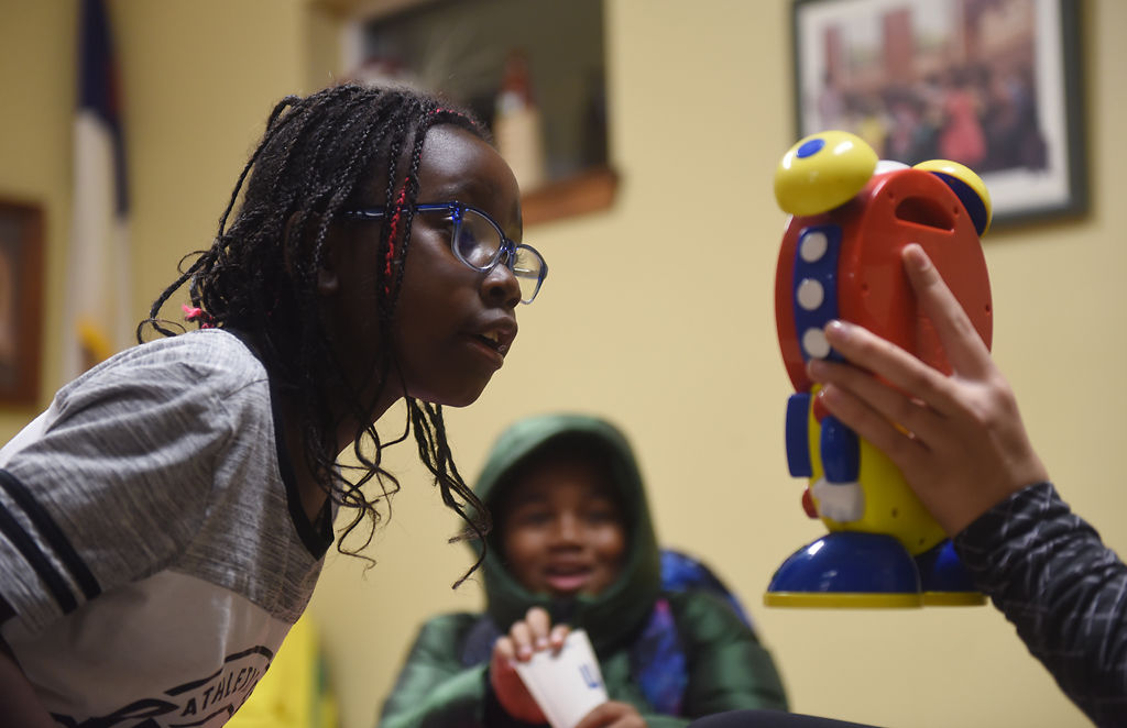 Lyla Oluoch stands up to read the clock